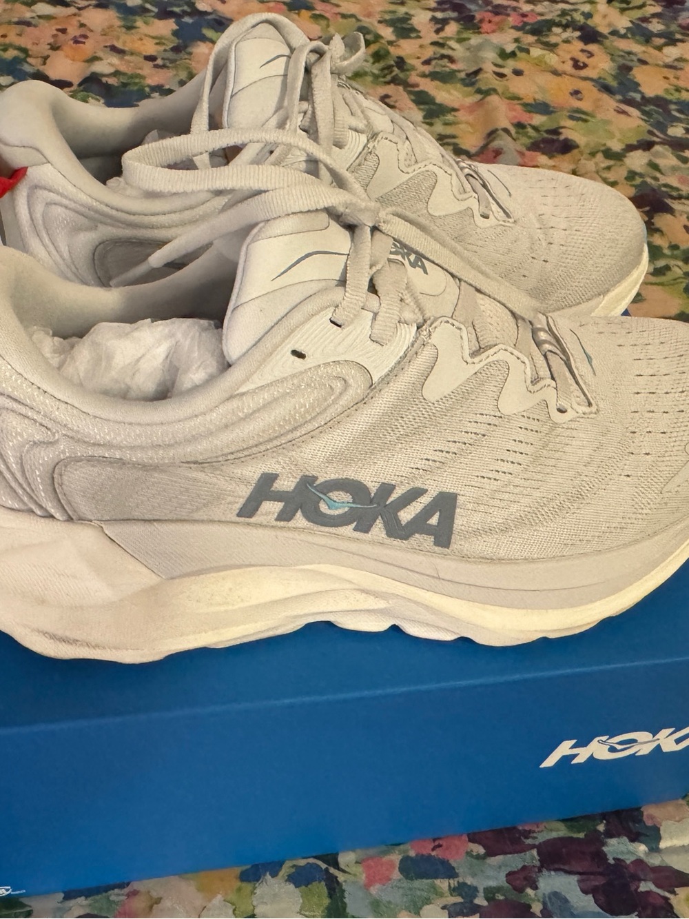 Hoka Woman’s Running Shoes in Light Gray with Blue Logo
